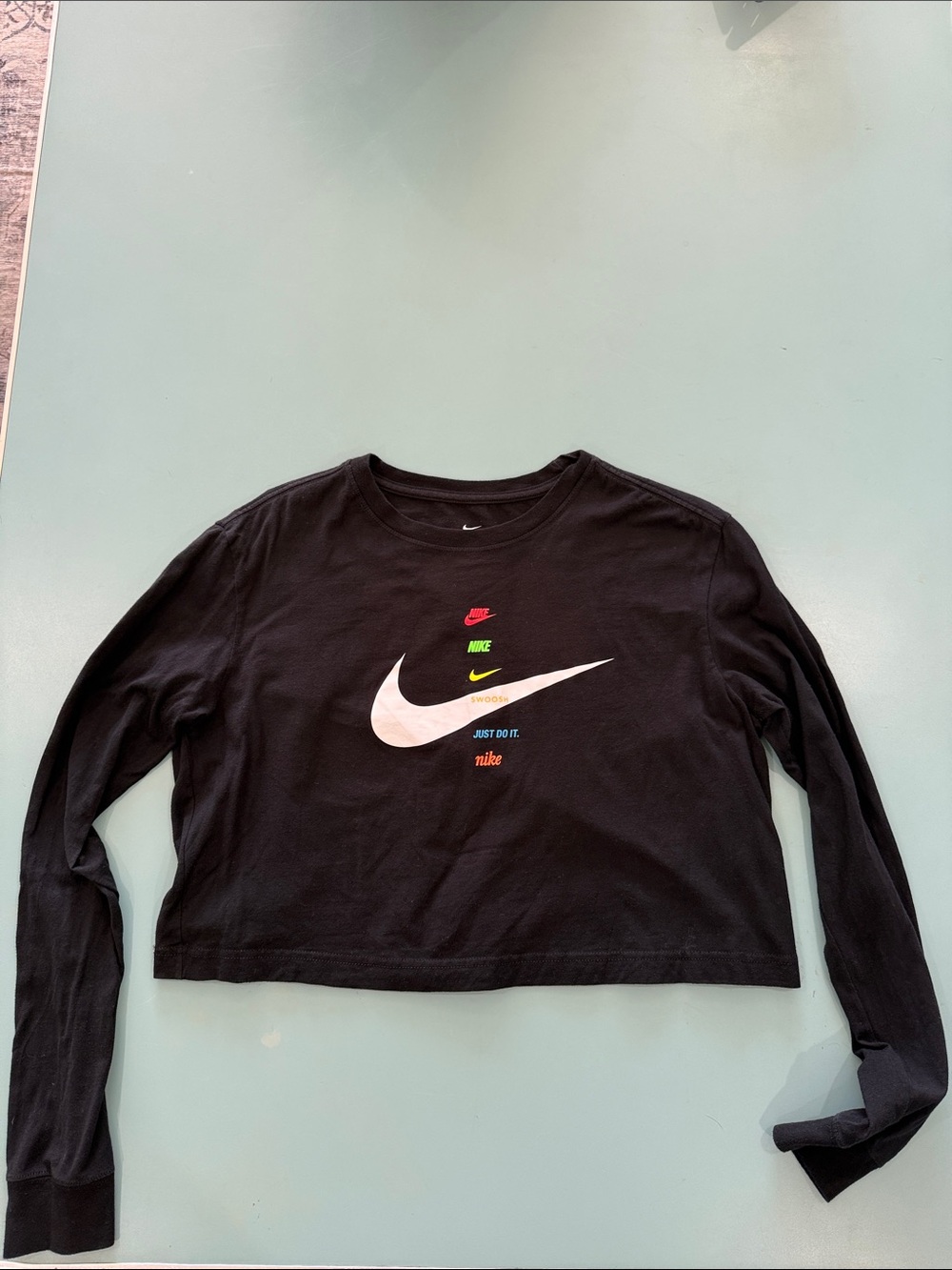 Nike Black Cropped Long Sleeve Tee with White Swoosh and Multicolor Logos